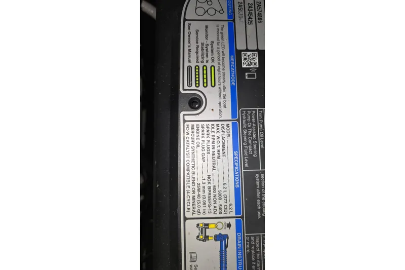 Slide: The Image of Label on 2018 Four Winns V355 boat engine, displaying specifications and maintenance instructions. - 37
