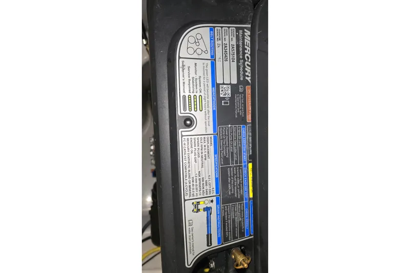 Slide: The Image of Mercury engine maintenance label on 2018 Four Winns V355 boat. - 39