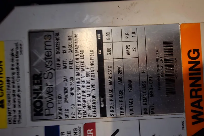 Slide: The Image of Kohler Power Systems label on 2018 Four Winns V355, detailing specifications and warnings. - 40