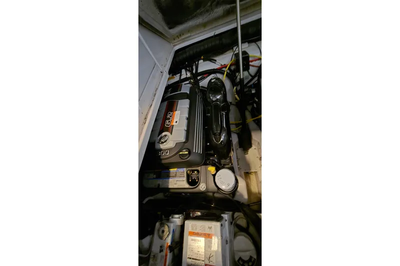 Slide: The Image of Engine compartment of a 2018 Four Winns V355 boat, featuring a 6.2-liter engine. - 43