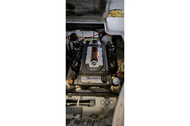 Slide: The Image of Engine compartment of a 2018 Four Winns V355 boat, showcasing a 300 horsepower engine. - 44