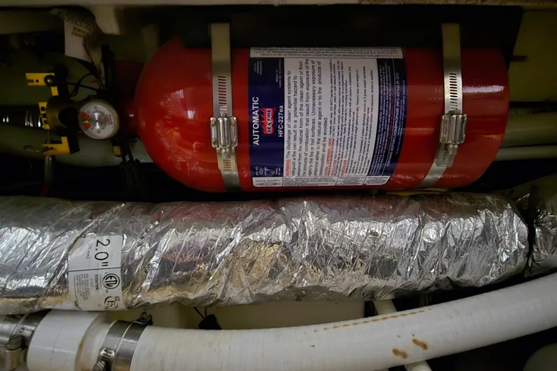 Slide: The Image of Engine compartment of 2018 Four Winns V355 with automatic fire extinguisher system. - 46