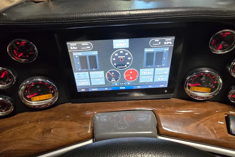 Slide: The Image of Dashboard of a 2018 Four Winns V355 boat with Garmin display and gauges. - 6
