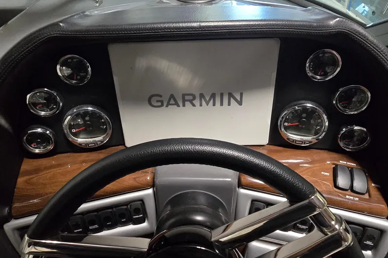 Slide: The Image of Dashboard of 2018 Four Winns V355 boat with Garmin display and gauges. - 7