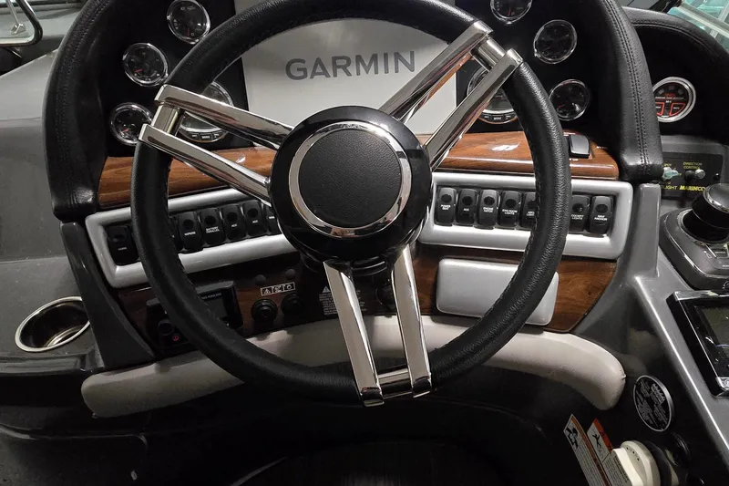 Slide: The Image of Steering wheel and dashboard of 2018 Four Winns V355 boat with Garmin navigation system. - 8