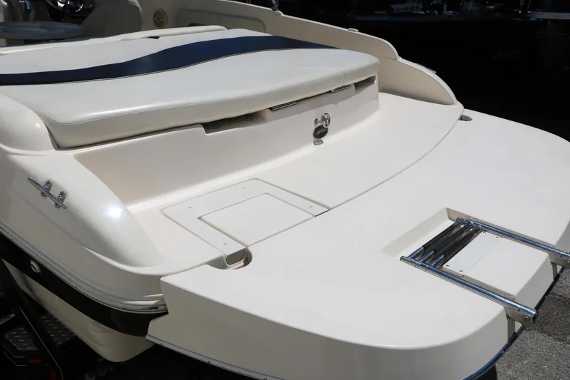 Slide: The Image of 2004 Rinker 212 Captiva Bowrider boat stern with swim platform and ladder. - 16