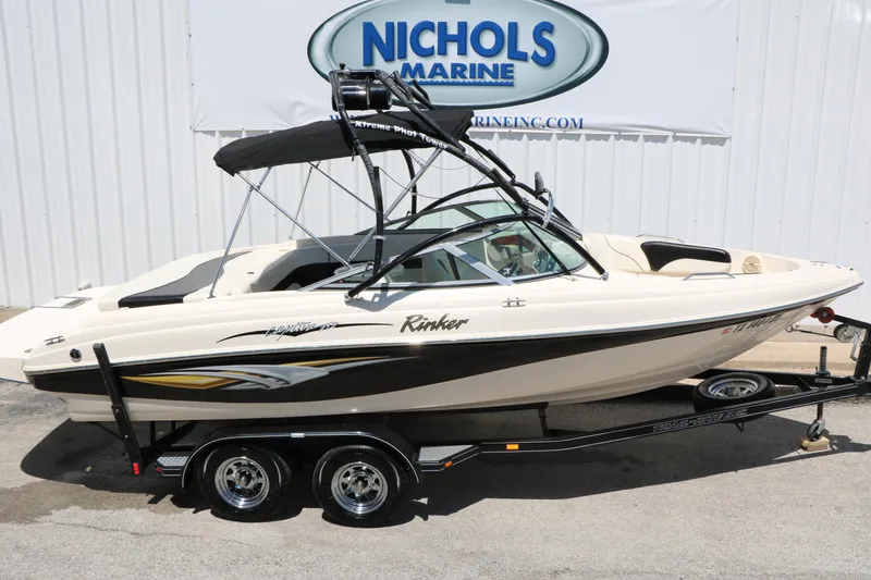Slide: The Image of 2004 Rinker 212 Captiva Bowrider boat on trailer at Nichols Marine dealership. - 20