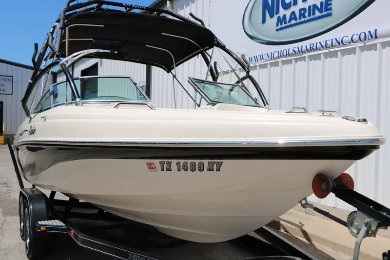 Slide: The Image of 2004 Rinker 212 Captiva Bowrider boat on trailer at Nichols Marine. - 3