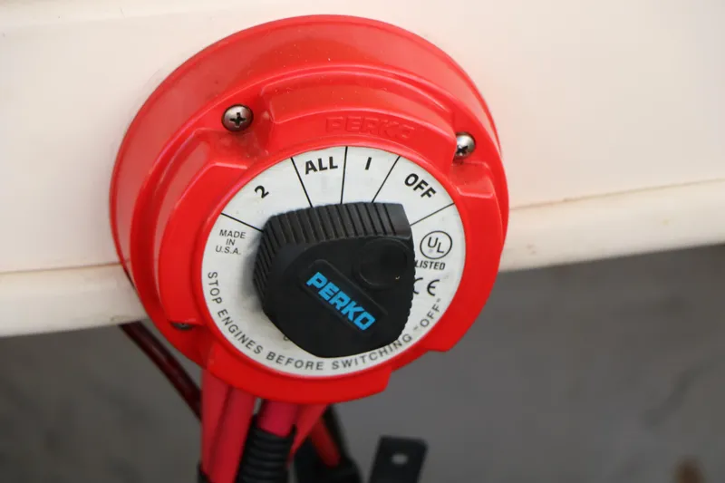 Slide: The Image of Red Perko battery switch on 2004 Rinker 212 Captiva Bowrider boat. - 42