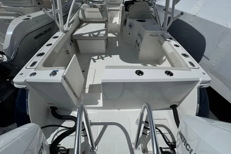 Slide: The Image of 2026 World Cat 280 DC-X boat interior with seating and storage compartments. - 14