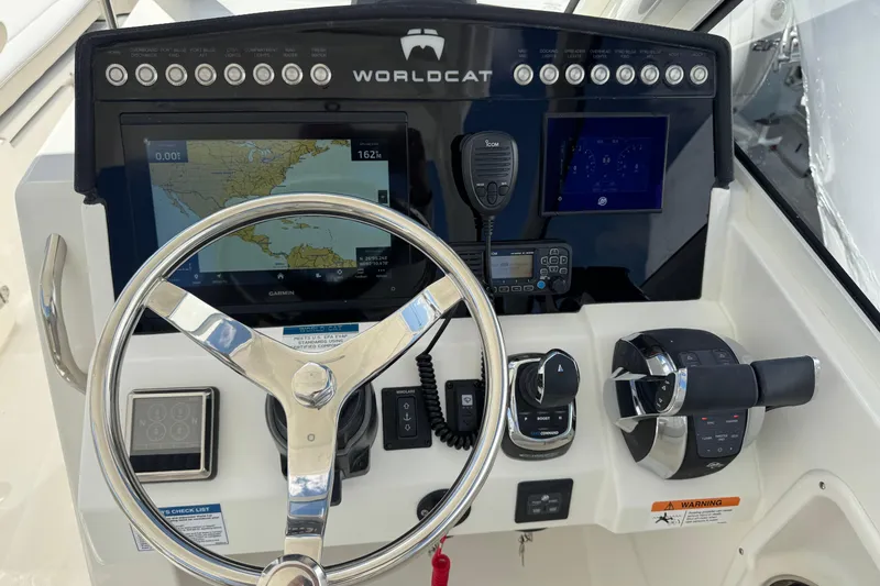 Slide: The Image of Helm of 2026 World Cat 280 DC-X with navigation and control systems. - 3