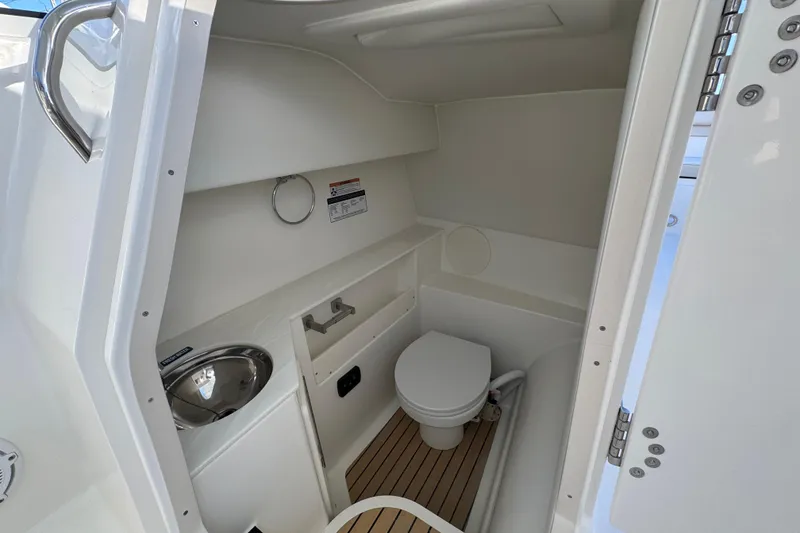 Slide: The Image of Interior of 2026 World Cat 280 DC-X boat bathroom with sink and toilet. - 4
