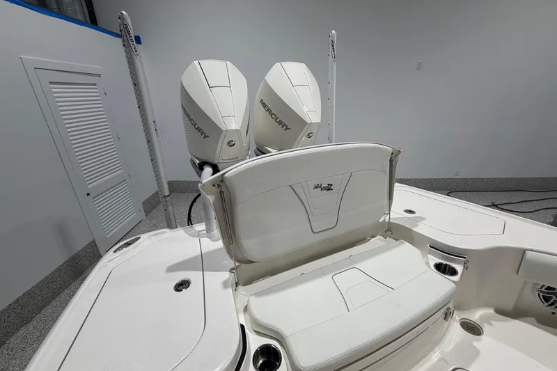 Slide: The Image of 2025 SeaVee 270Z boat with dual Mercury engines in a showroom setting. - 17