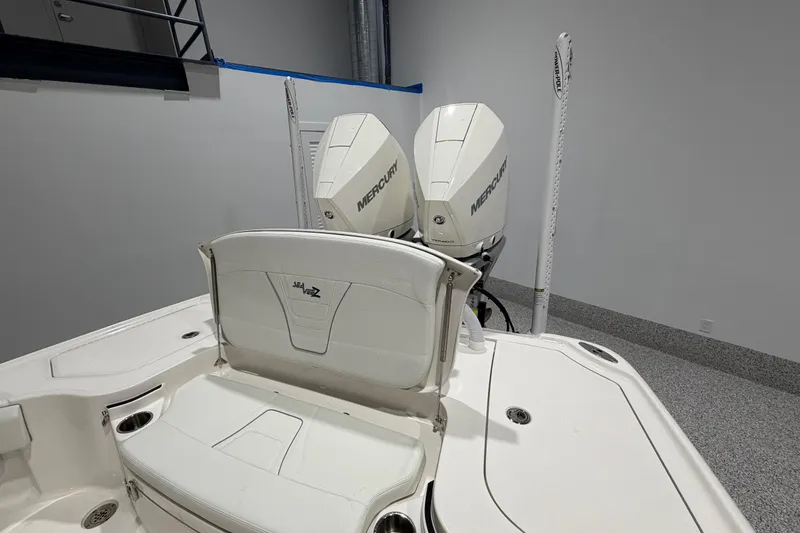 Slide: The Image of 2025 SeaVee 270Z boat with dual Mercury engines in a showroom setting. - 18