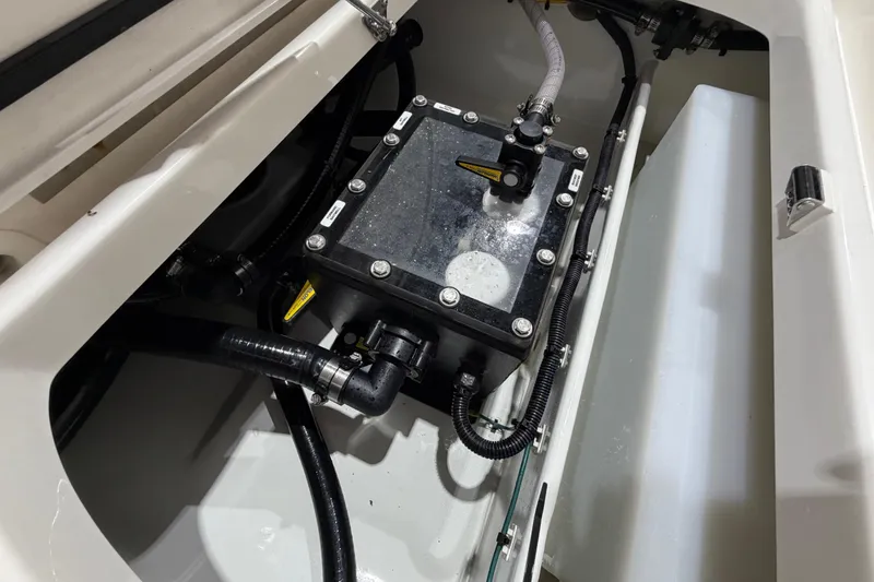 Slide: The Image of Engine compartment of 2025 SeaVee 270Z boat, showcasing mechanical components and wiring. - 19