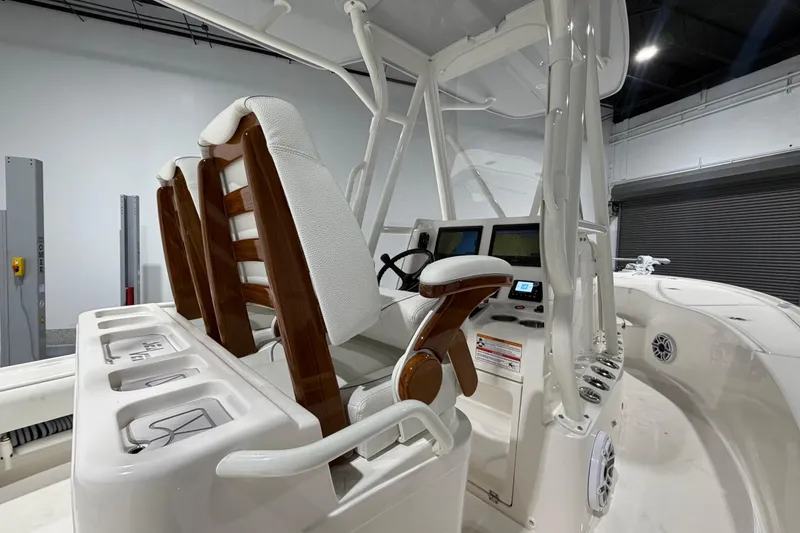 Slide: The Image of 2025 SeaVee 270Z boat interior with helm, seating, and navigation displays. - 23
