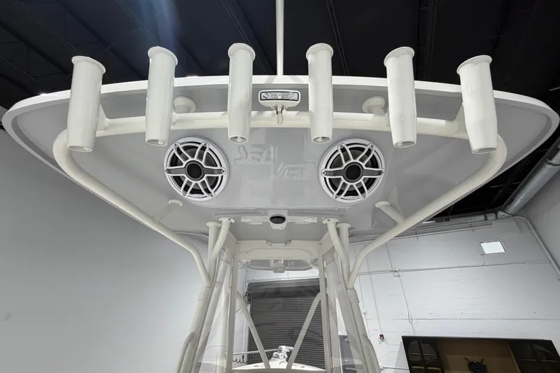 Slide: The Image of 2025 SeaVee 270Z boat with rod holders and speakers, viewed from below. - 24