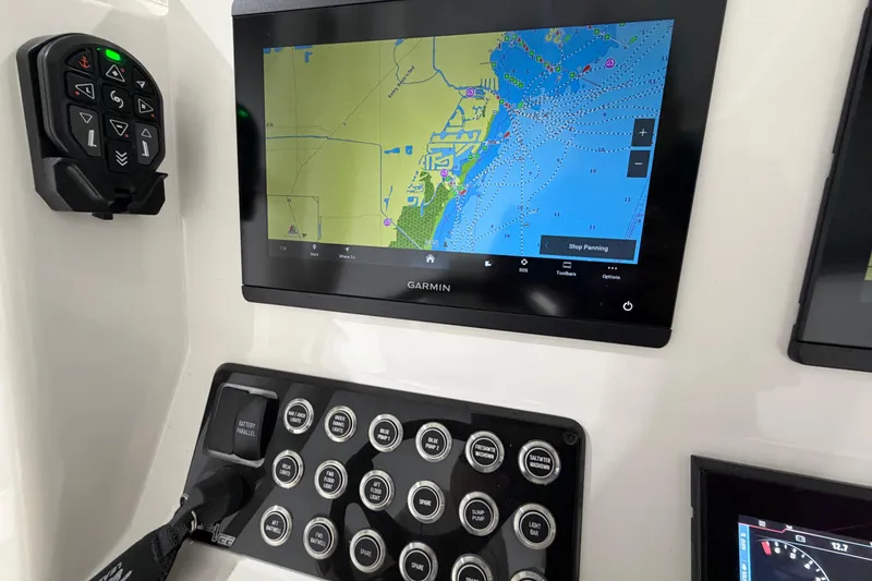Slide: The Image of Garmin navigation system on 2025 SeaVee 270Z boat dashboard with control panel. - 29