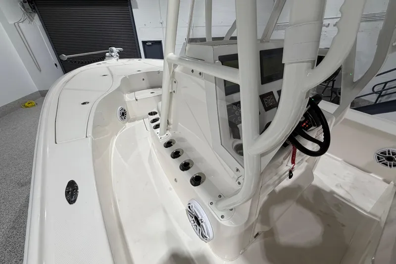 Slide: The Image of 2025 SeaVee 270Z boat interior with steering console and seating area. - 34