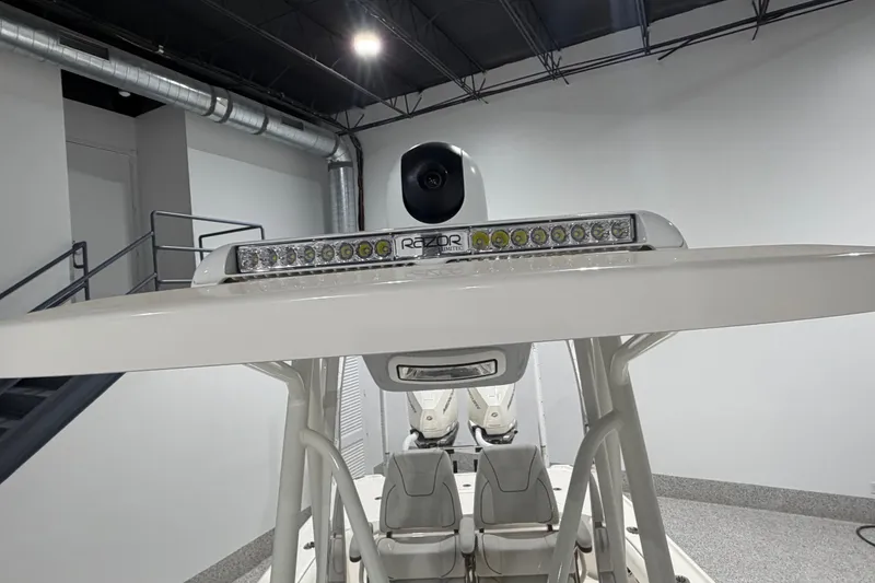 Slide: The Image of 2025 SeaVee 270Z boat with advanced radar and lighting system in a modern showroom. - 37