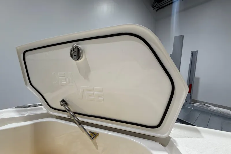 Slide: The Image of 2025 SeaVee 270Z boat hatch open, showcasing interior storage space. - 47