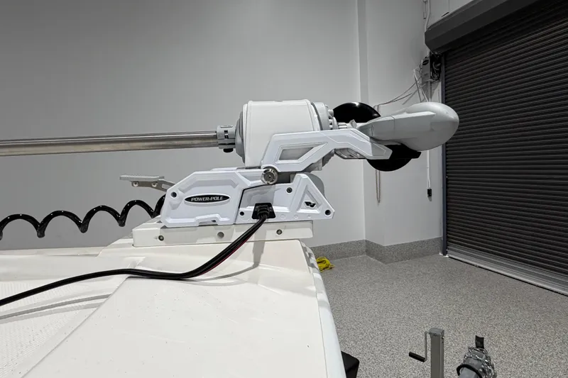 Slide: The Image of Power-Pole anchor system on 2025 SeaVee 270Z boat in a garage setting. - 48