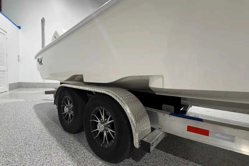 Slide: The Image of 2025 SeaVee 270Z boat on trailer in a garage setting. - 9