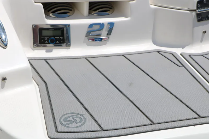 Slide: The Image of 2023 Chaparral 21 SSi Ski & Fish boat deck with stereo system and logo. - 12