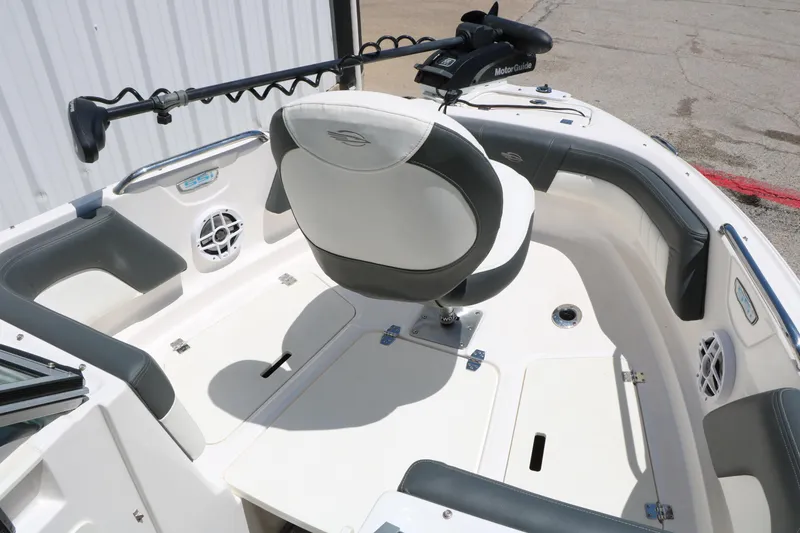 Slide: The Image of 2023 Chaparral 21 SSi Ski & Fish boat interior with seating and fishing equipment. - 24