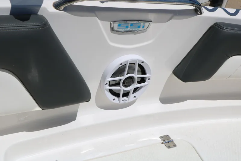 Slide: The Image of 2023 Chaparral 21 SSi Ski & Fish boat interior with speaker and cushioned seating. - 25