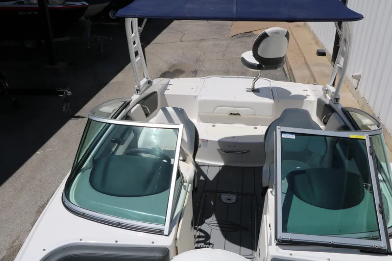 Slide: The Image of 2023 Chaparral 21 SSi Ski & Fish boat interior with seating and windshield. - 29