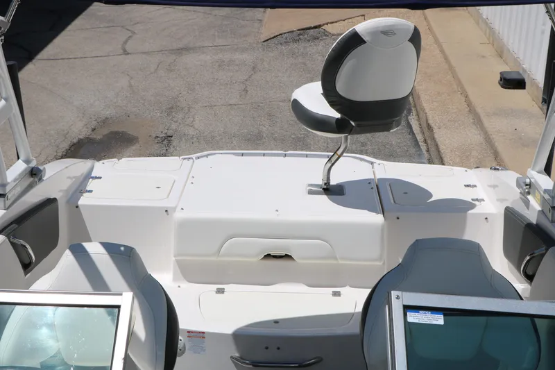 Slide: The Image of 2023 Chaparral 21 SSi Ski & Fish boat interior with seating and storage compartments. - 30