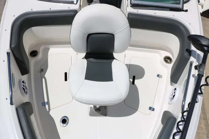 Slide: The Image of 2023 Chaparral 21 SSi Ski & Fish boat interior with swivel seat and storage compartments. - 31