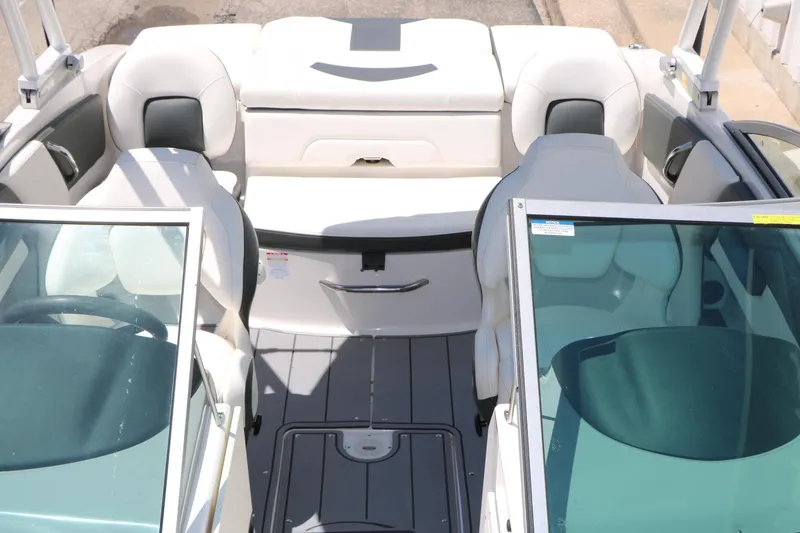 Slide: The Image of 2023 Chaparral 21 SSi Ski & Fish boat interior with seating and windshield view. - 35