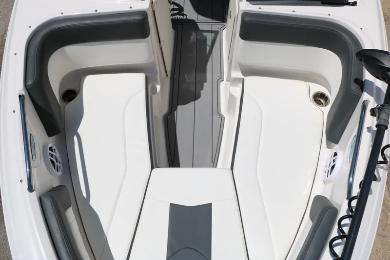 Slide: The Image of 2023 Chaparral 21 SSi Ski & Fish boat interior with cushioned seating and cup holders. - 36