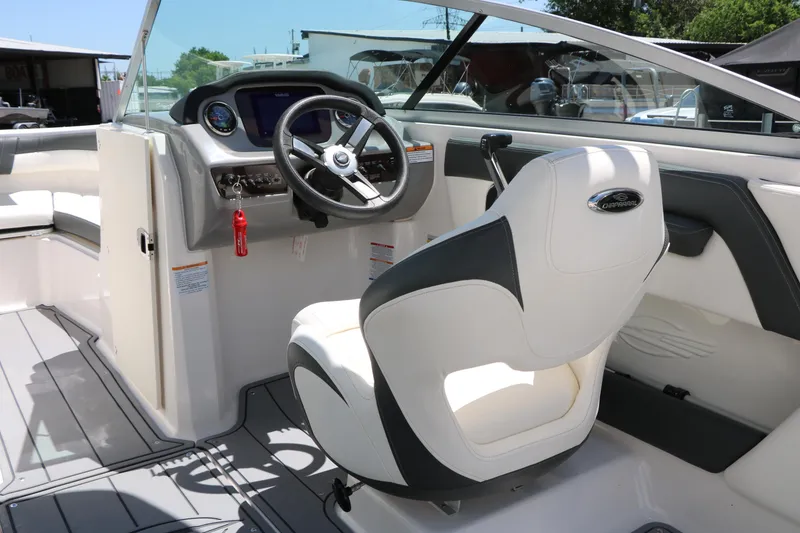 Slide: The Image of 2023 Chaparral 21 SSi Ski & Fish boat interior with steering wheel and seating. - 39