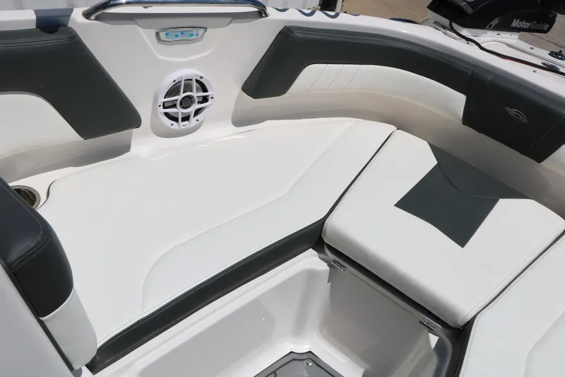 Slide: The Image of 2023 Chaparral 21 SSi Ski & Fish boat interior with cushioned seating and speaker. - 43