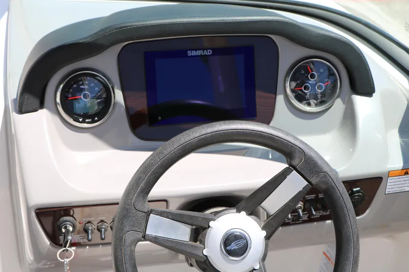 Slide: The Image of Dashboard of 2023 Chaparral 21 SSi Ski & Fish boat with steering wheel and gauges. - 47