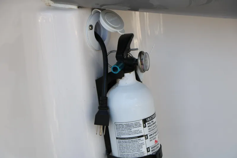 Slide: The Image of Fire extinguisher mounted on 2023 Chaparral 21 SSi Ski & Fish boat. - 50