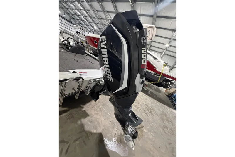 Slide: The Image of 2020 Vexus AVX 2080 with Evinrude outboard motor in a boat showroom. - 11