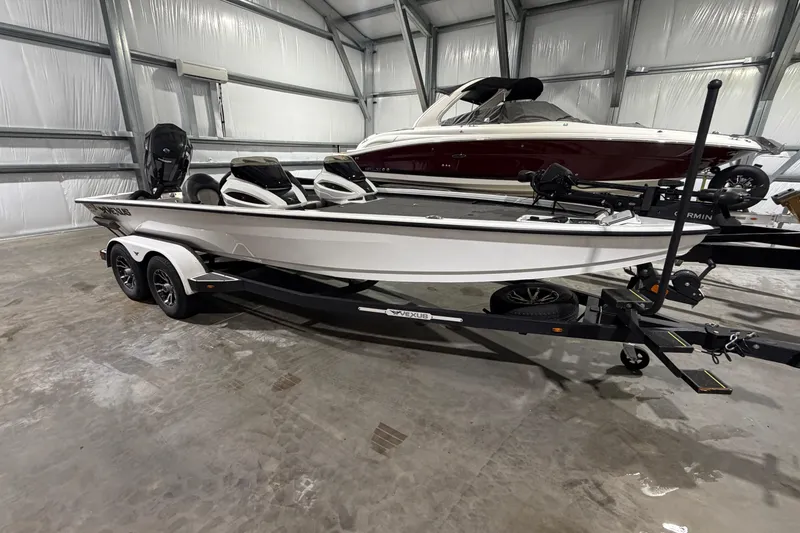 Slide: The Image of 2020 Vexus AVX 2080 boat on trailer in indoor storage facility. - 2