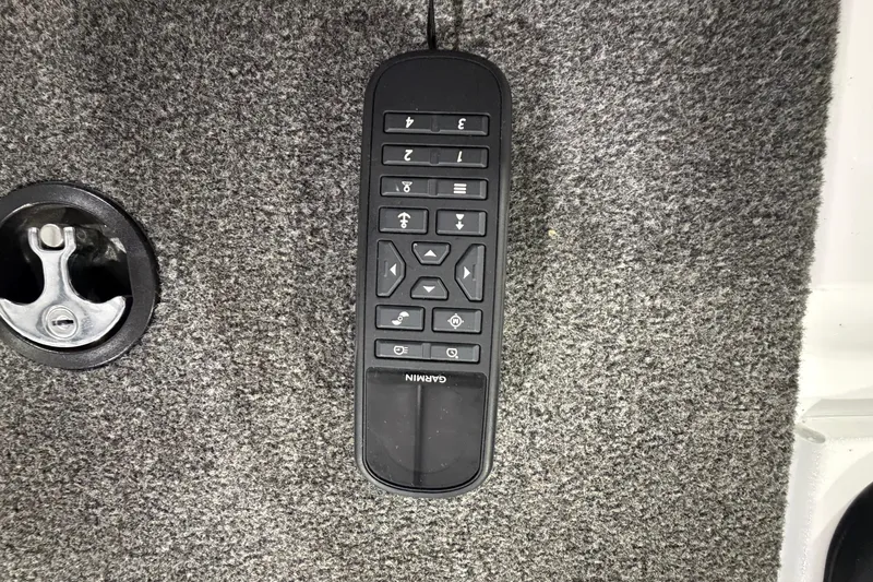 Slide: The Image of Garmin remote control on 2020 Vexus AVX 2080 boat carpet floor. - 25