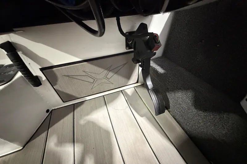 Slide: The Image of Interior of a 2020 Vexus AVX 2080 boat showing foot pedal and flooring. - 26