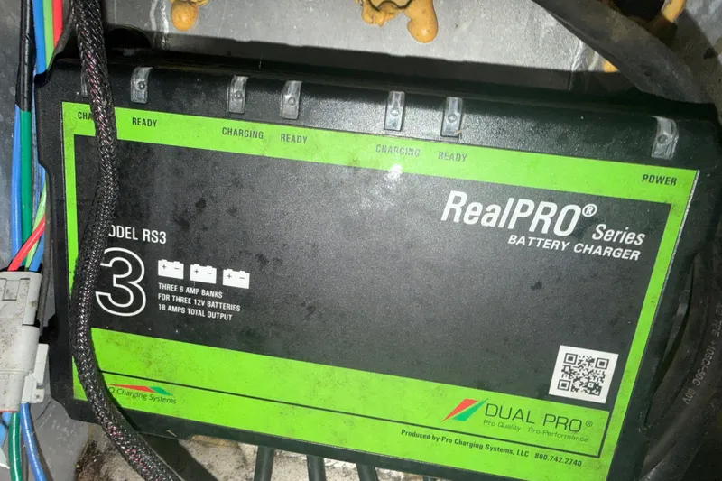 Slide: The Image of Battery charger in a 2020 Vexus AVX 2080, RealPRO Series Model RS3, 18 amps output. - 27