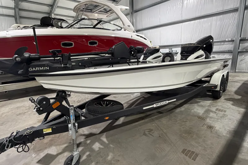 Slide: The Image of 2020 Vexus AVX 2080 boat on trailer in indoor storage facility. - 6
