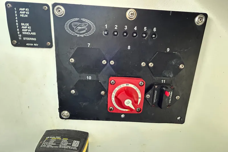 Slide: The Image of Control panel of a 2020 Cobalt 23SC boat with switches and labels. - 101