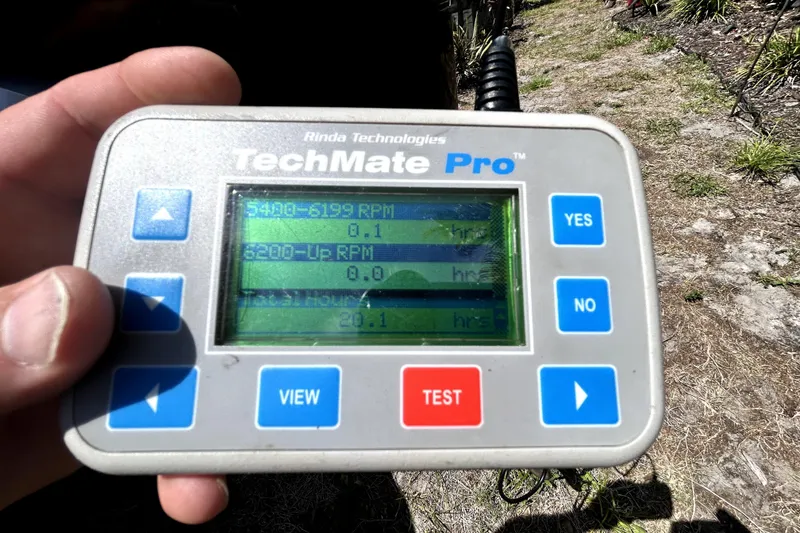 Slide: The Image of Hand holding a TechMate Pro diagnostic tool displaying RPM data for a 2020 Cobalt 23SC. - 102