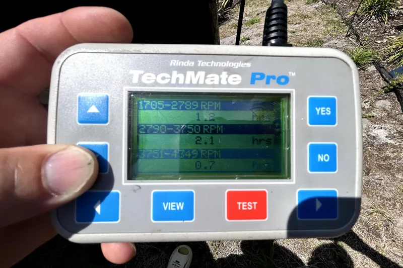 Slide: The Image of Hand holding a TechMate Pro diagnostic tool displaying RPM data for a 2020 Cobalt 23SC. - 105