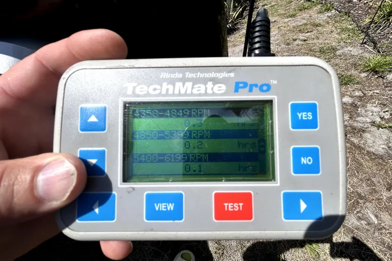 Slide: The Image of Hand holding TechMate Pro diagnostic tool displaying RPM data for Cobalt 23SC, 2020 model. - 106