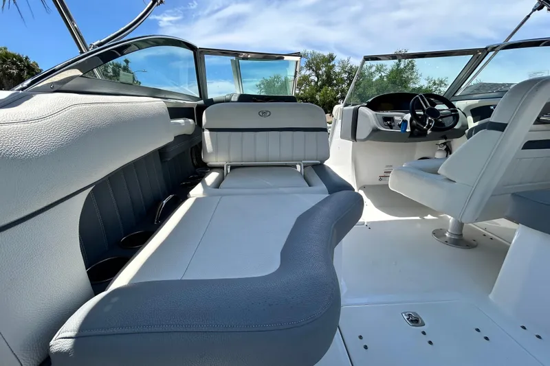 Slide: The Image of Interior of a 2020 Cobalt 23SC boat with sleek seating and modern design. - 28